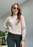 Knitted sweater for warm winter in beige